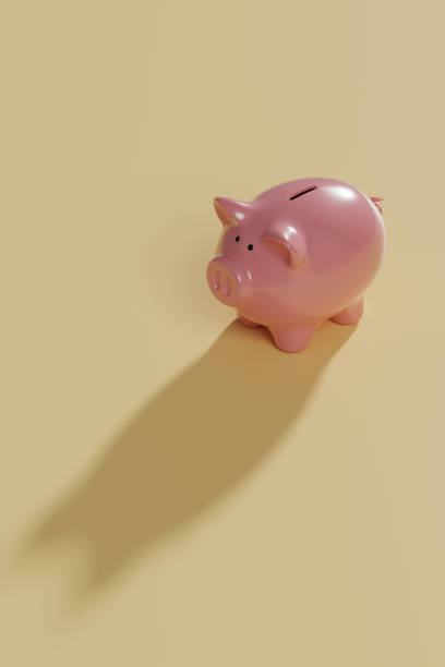 istock Piggy bank casting shadow on a yellow background. 3d illustration. 2162038447