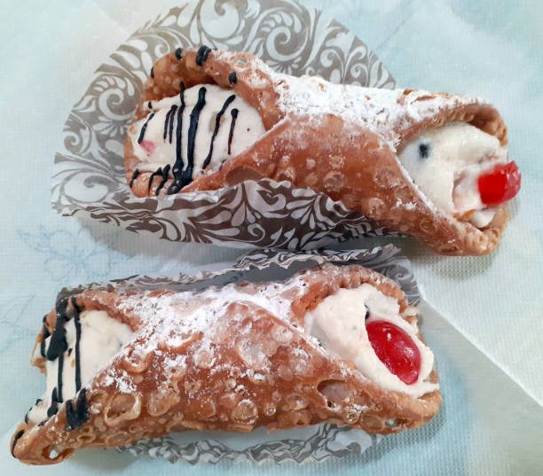 istock two beautiful Sicilian cannoli ready to be enjoyed 2162040939
