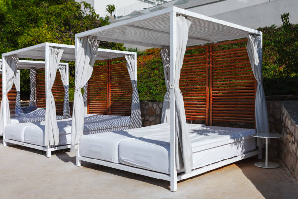 istock Beach beds with curtains are arranged in a row 2162041196