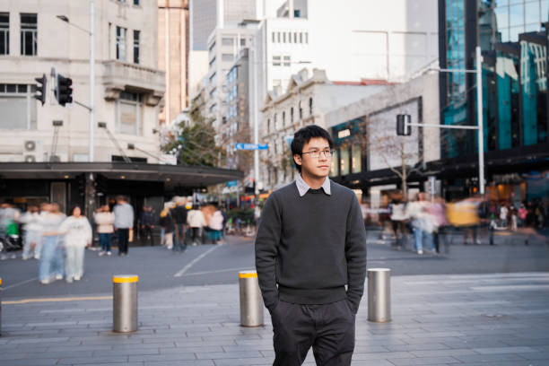 istock Young Asian man in a bustling urban environment 2162041483
