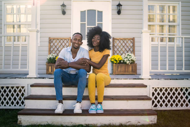 istock A happy couple sitting on their front steps 2162042542