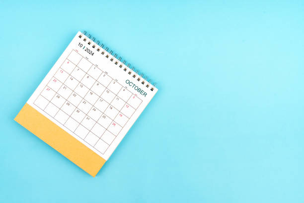 istock 2024 October Desk Calendar On Blue Background. Composition with copy space. 2162042805