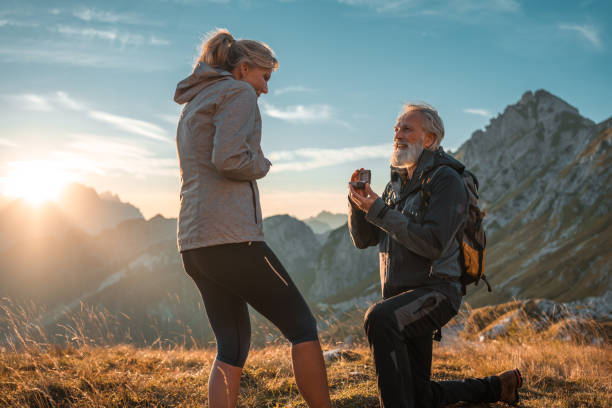 istock Handsome Mature Couple Trailside Engagement 2162044939