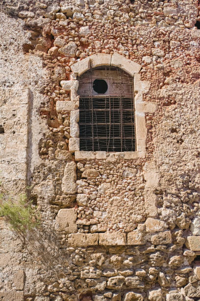 An old, ancient wall of an abandoned building in Chania, Crete, Greece.  Useful as background.