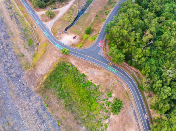 istock Aerial view Curve road top view rainforest trees summer background 2162046409