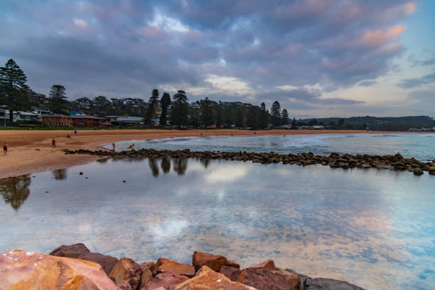 Sunrise seascape with an overcast sky and clouds at Avoca Beach on the Central Coast, NSW, Australia.