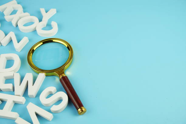 istock magnifying glass with space for text on blue background 2162051929