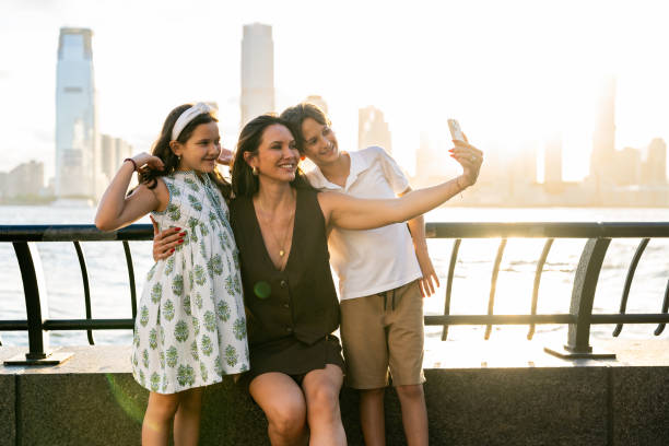 istock Mother taking a selfie with her two children at sunset 2162052067