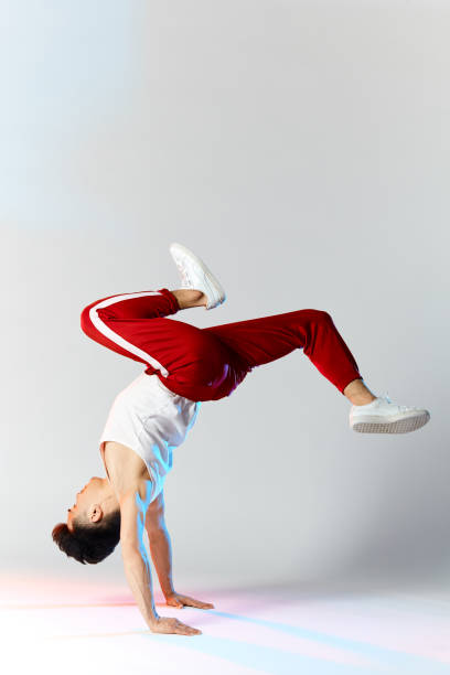 istock Asian personal break dancer trainer doing handstand on white background 2162052764