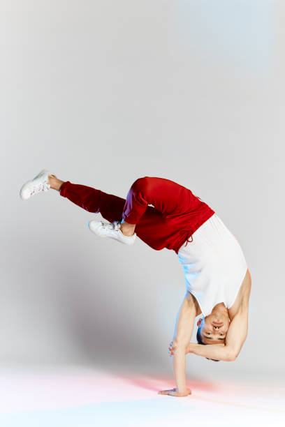 istock Asian personal break dancer trainer doing handstand on white background 2162052798