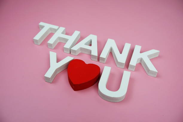 istock Thank You alphabet letters top view on pink background 2162052920