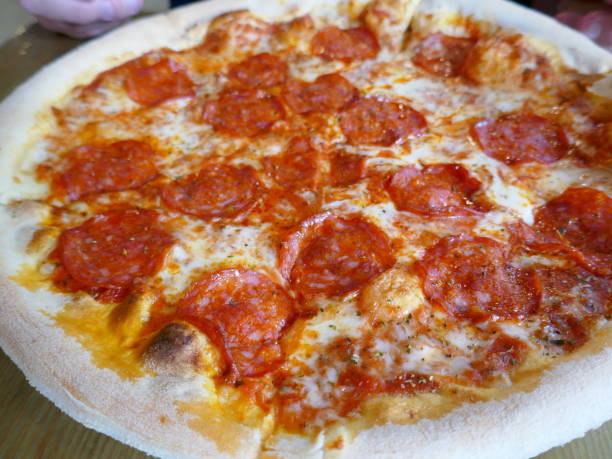 istock Appetizing pepperoni pizza with melted cheese and oregano 2162056952