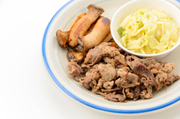 sauteed pork and king oyster mushrooms with dressed mustard cabbage
