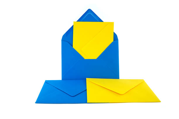 istock Blue and yellow envelopes arranged against a white background 2162058081
