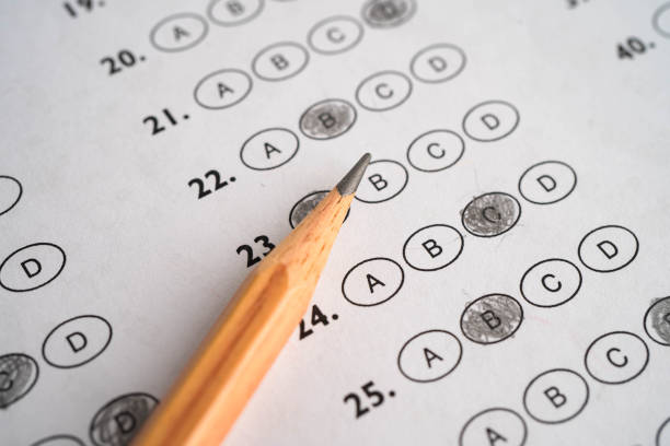 istock Answer sheets with pencil drawing fill to select choice education. 2162058425