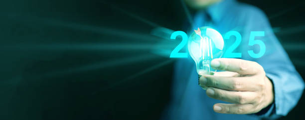 istock 2025 idea and goal. A man holds illuminating lightbulb with virtual dartboard icon representing target and strategic plan for business, technology, or personal life in the new year to come 2162058537
