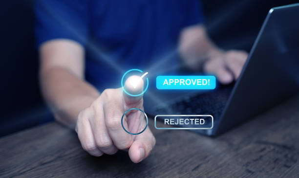 istock Approve concept. A man taps on an approved choice and make a correct sign mark for document approval , project  assessment evaluation acceptance, and quality assurance 2162058541