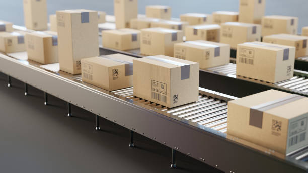 istock Cardboard boxes on conveyor belt line. Sorting, shipping and transportation concept. 2162063097