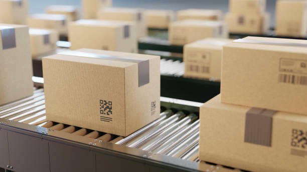 istock Cardboard boxes on conveyor belt line. Sorting, shipping and transportation concept. 2162063143