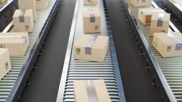 istock Cardboard boxes on conveyor belt line. Sorting, shipping and transportation concept. 2162063172