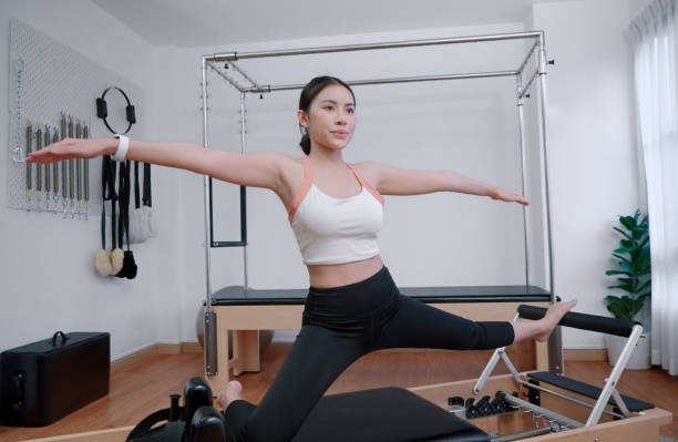 istock Asian woman exercise on pilates machine 2162063186