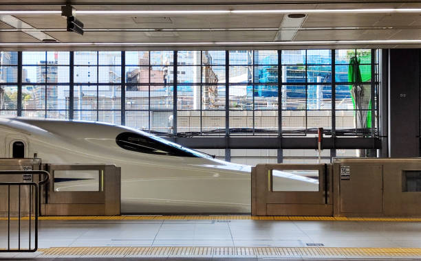 Shinkansen train at railway platform in Shinagawa station, a major railway station in the Takanawa and Konan districts of Minato, Tokyo, Japan