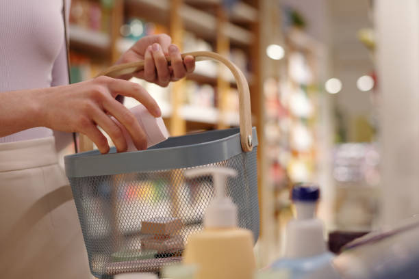istock Putting cream into shopping basket 2162066709