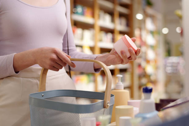 istock Holding cream over shopping basket 2162066981