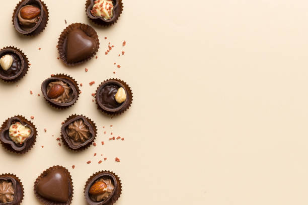 istock Different kinds of chocolates on colored table close-up. Top View and Flat Lay with copy space 2162067091