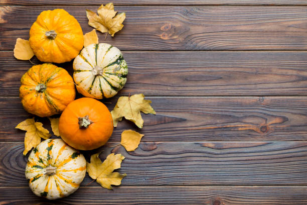istock Autumn composition. Pattern made of dried leaves and other design accessories on table. Flat lay, top view 2162067125