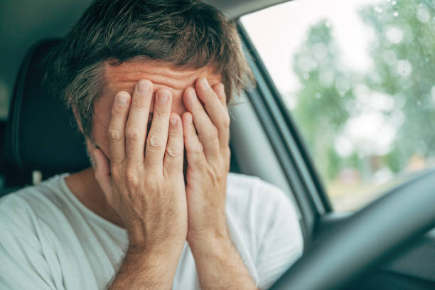 istock Sad disappointed male driver crying in car 2162067297