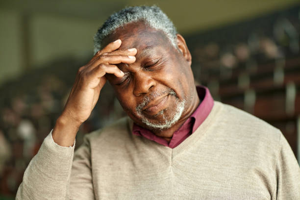 istock African American senior man having a headache. 2162068404