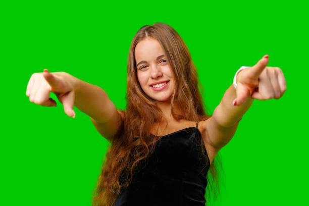 Young Woman in Black Top Pointing at Something
