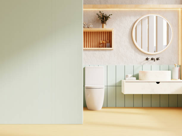 istock Mockup wall in a modern bathroom setting, featuring pastel green accents, a sleek white sink on a floating vanity- 3D rendering 2162068603