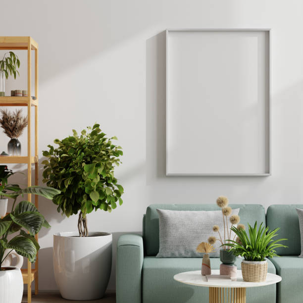 Mockup frame poster hanging on a white wall above a light green sofa, surrounded by various indoor plants in a cozy living room setting- 3D rendering