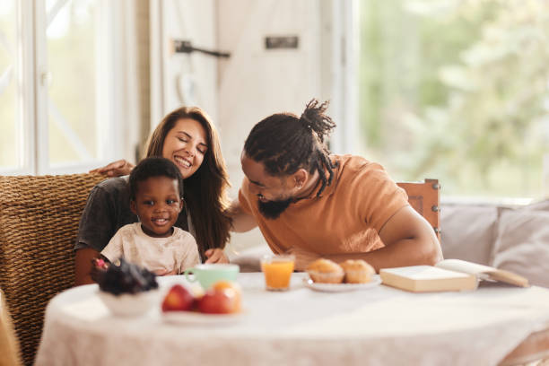 istock Happy diverse family talking at dining table. 2162069303
