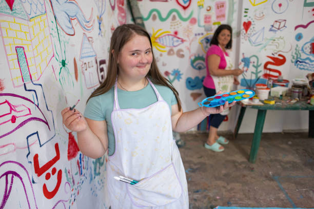 istock Teacher Helps with Painting 2162072220
