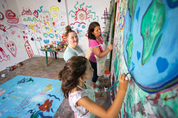istock Art Lesson with Sisters and Their Teacher 2162072478
