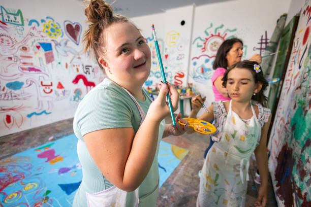 istock Sisters and Teacher Creating Art Together 2162072544
