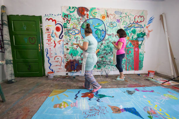 istock Sisters Painting Together 2162072586