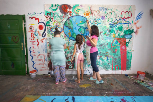 istock Sisters Painting Together 2162072588