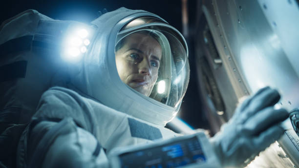 istock Portrait of Professioanal Astronaut Performing a Routine Maintenance Check Outside a Spacecraft in Zero Gravity in Outer Space. Technology, Scientific Exploration, Female Empowerment Concept 2162076892