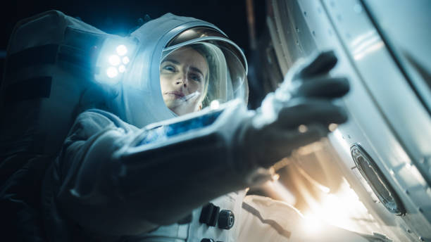 istock Portrait of Professioanal Astronaut Performing a Routine Maintenance Check Outside a Spacecraft in Zero Gravity in Outer Space. Space Technology, Scientific Exploration, Female Empowerment Concept 2162076920