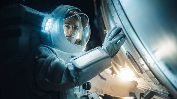 istock Portrait of Professioanal Astronaut Performing a Routine Maintenance Check Outside a Spacecraft in Zero Gravity in Space. Space Technology, Scientific Exploration, Female Empowerment Concept 2162076934