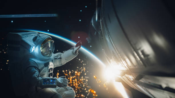 istock Professional Astronaut Performing a Routine Maintenance Check Outside a Spacecraft in Zero Gravity in Outer Space. Advanced Space Technology, Scientific Exploration and Female Empowerment Concept 2162077075