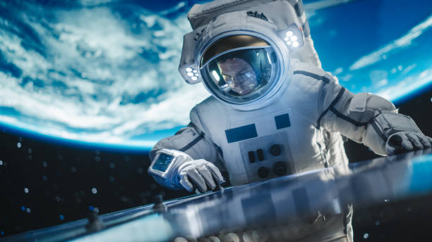 istock Astronaut on an Extravehicular Mission in Outer Space Far From Planet Earth. Courageous Man Fixing and Adjusting the Angle on a Solar Panel Module Outside the Space Station During a Service Procedure 2162077167