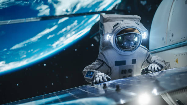 istock Portrait of a Handsome Young Astronaut Investigating a Solar Panel on a Satellite in Outer Space. Trained Professional in a Space Suit Performing Extravehicular Activity Outside the Spacecraft 2162077179