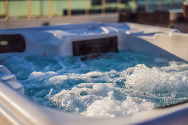 hot tub hydromassage pool. illuminated pool. rest outside the city. cottage with hydromassage pool - ジャグジー ストックフォトと画像