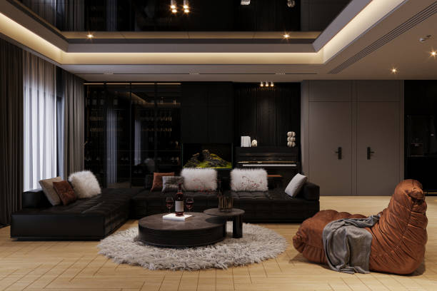 istock A luxurious and elegant home decor with a black modular sofa, a couch, center table on the puff. 2162080331