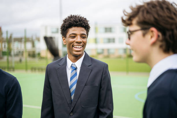istock London schoolboys in uniform taking a break from class 2162080806